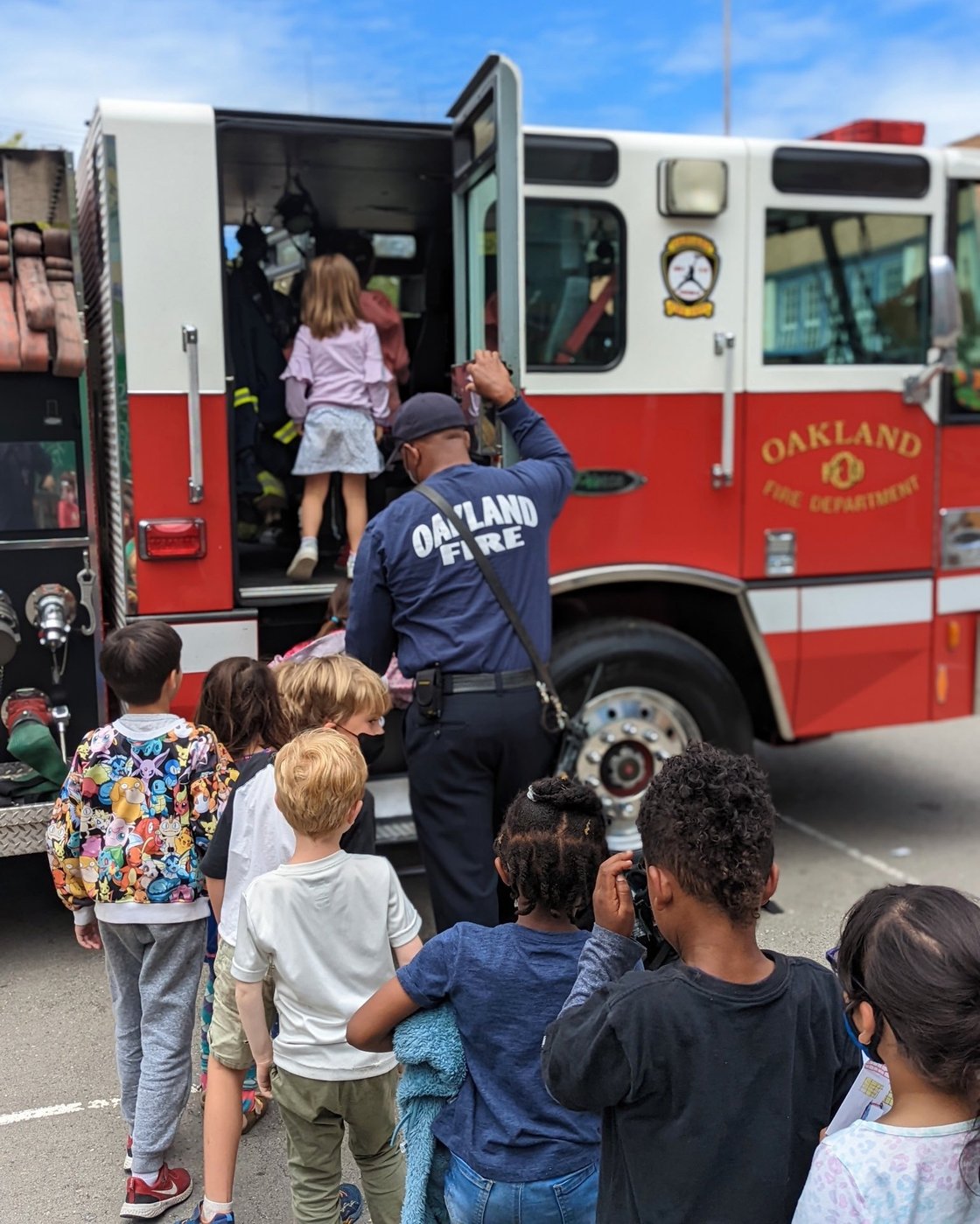 Oakland Fire Dept with Kids on a Fire Truck